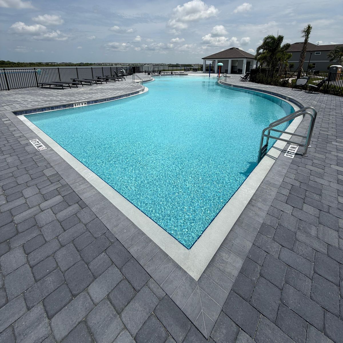 The same community pool after recovery, water clear and bright blue